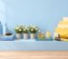 Pastel-styled salon retail shelf with professional hair care products, styling tools and fresh flowers, illustrating wha