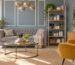 Stylish salon consultation corner with a sofa, glass coffee table and a shelf of styling tools and brushes, suitable for