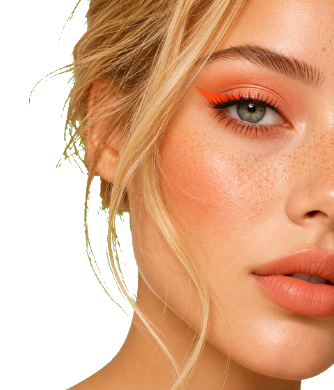 Extreme close-up of a model's eye and lips with bold orange eyeliner and peach lip colour