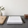 Signed commercial lease and shareholder agreement documents with a pen on a dark desk, in a South African law office