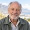 Elderly white South African man with grey beard, client testimonial headshot