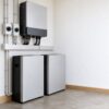 close-up of a properly installed inverter and battery backup system in a home utility area