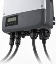 Close-up of the bottom connection ports of a 5kW grid tie inverter with DC cables plugged in
