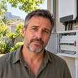 natural portrait of a South African homeowner illustrating a blog post about a solar backup system tripping