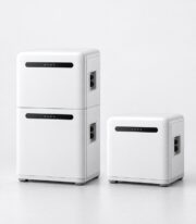 stackable 5kWh home battery module shown front three-quarter with a second module beside it