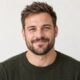 Smiling South African man with short beard, customer avatar headshot