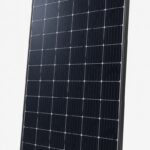 Unbranded monocrystalline 450W solar panel with black frame, shown at a slight angle on a light grey studio background