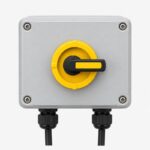 Unbranded rooftop DC isolator box, compact weatherproof enclosure with rotary isolator switch and cable glands, front vi